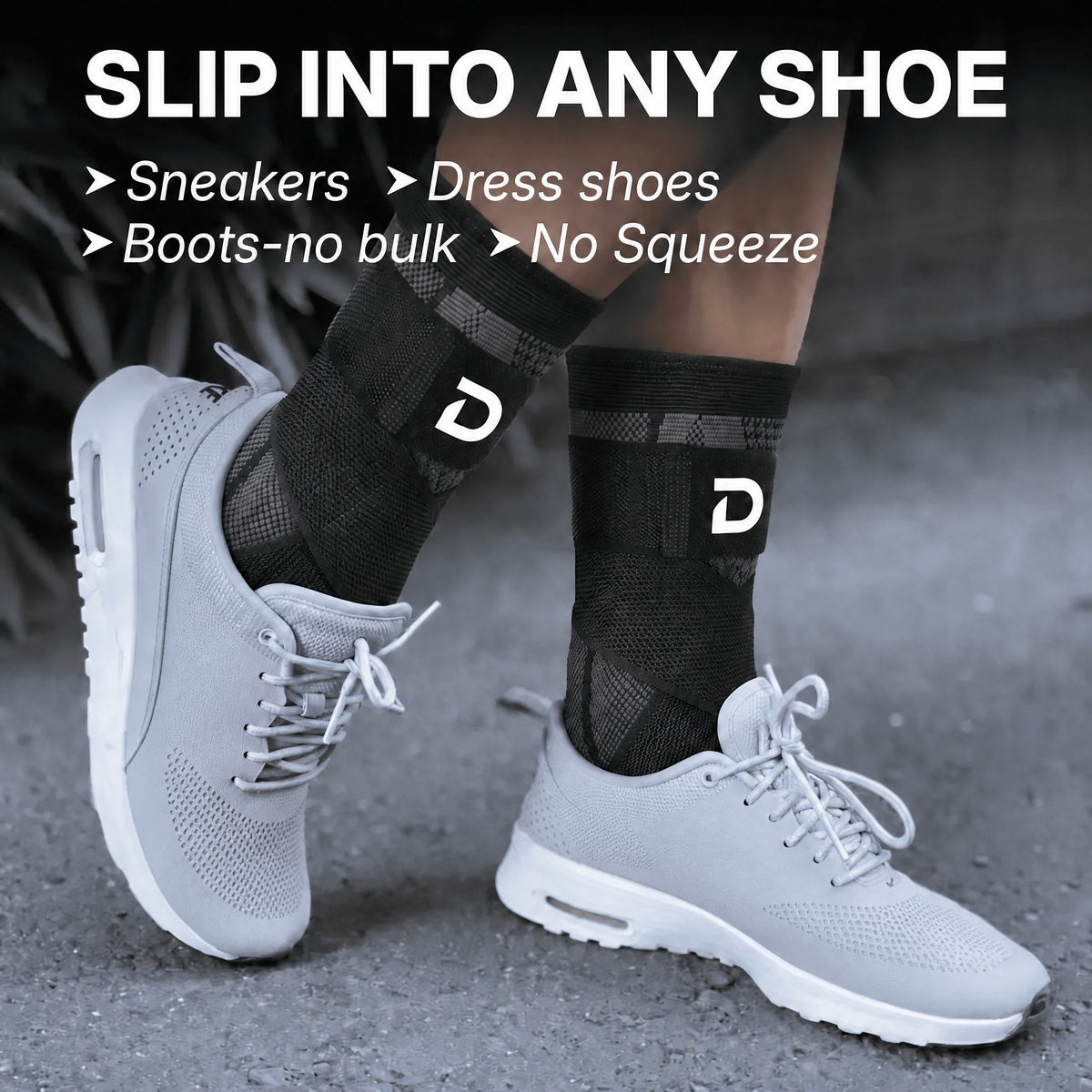 Two feet in grey sneakers wearing the slim black sleeve with its strap, under the words Slip into any shoe.